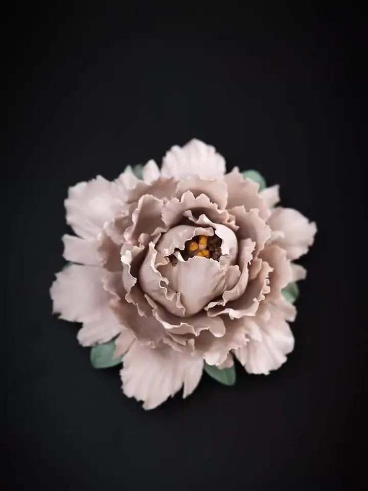 Fire and colour: The flower is fired, then coloured. Hover to see the change.